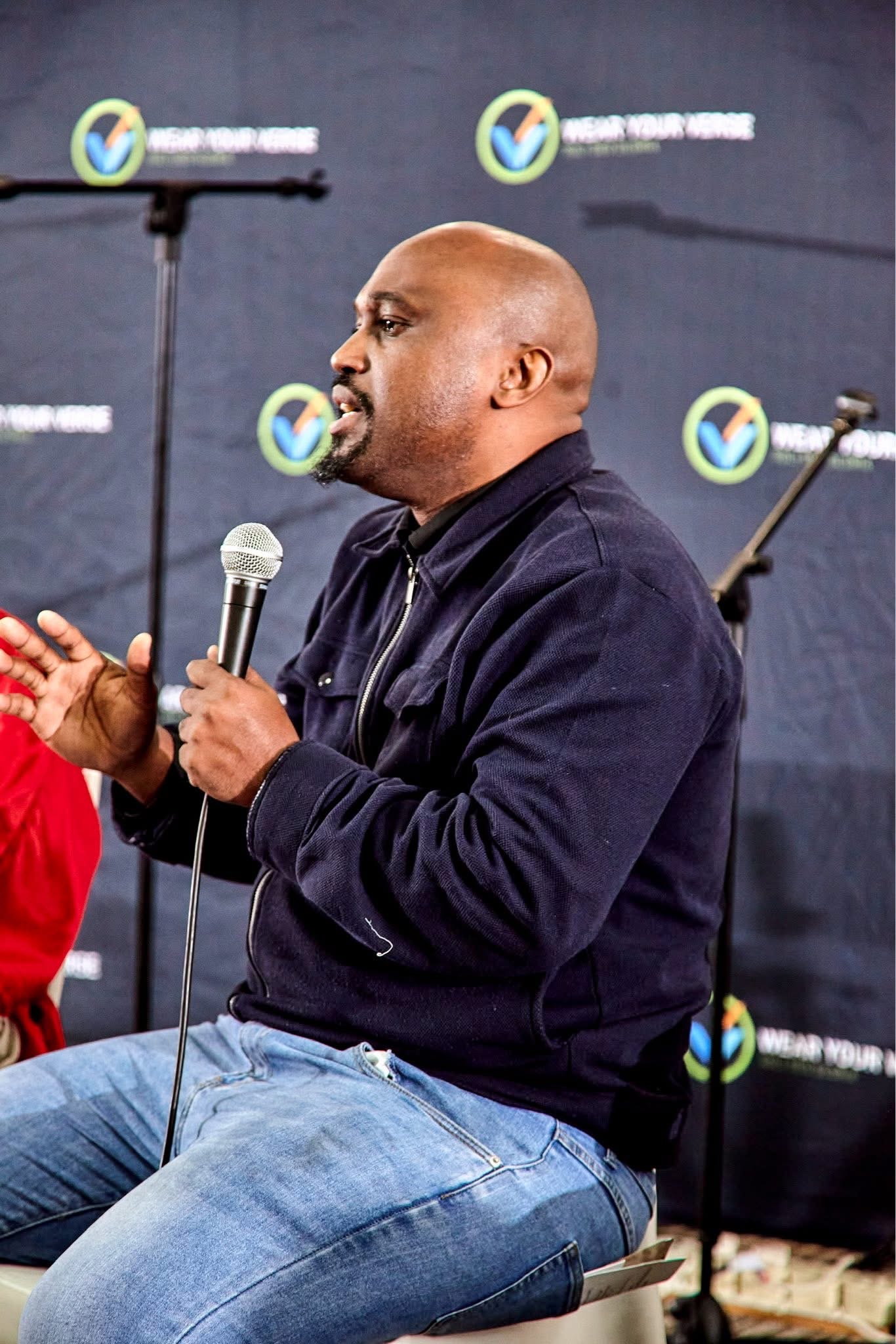 Lwandiso Dlokweni speaking at a Christian ministry gathering
